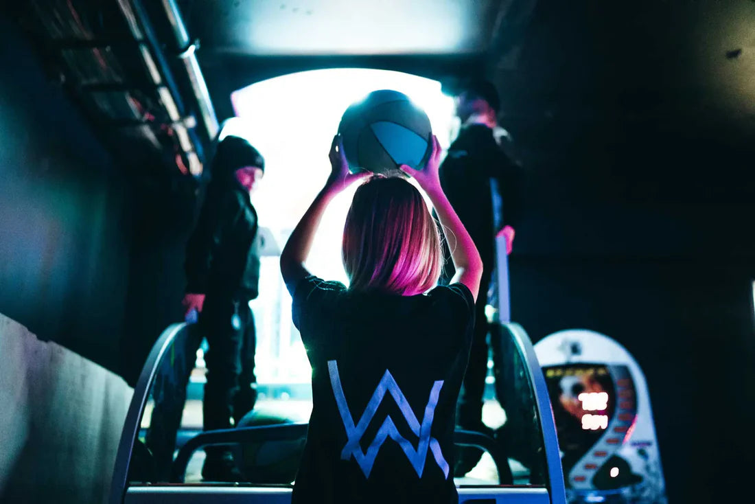 Child in a black Alan Walker logo t-shirt, playing and having fun, showcasing the casual and comfy style.
