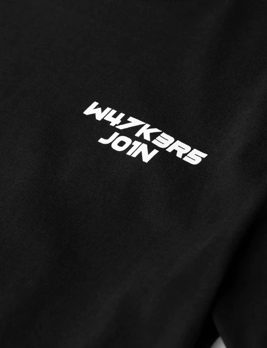 Zoomed-in view of the 'W4LK3RS JOIN' text on the kids black t-shirt, inviting to the Walker community.