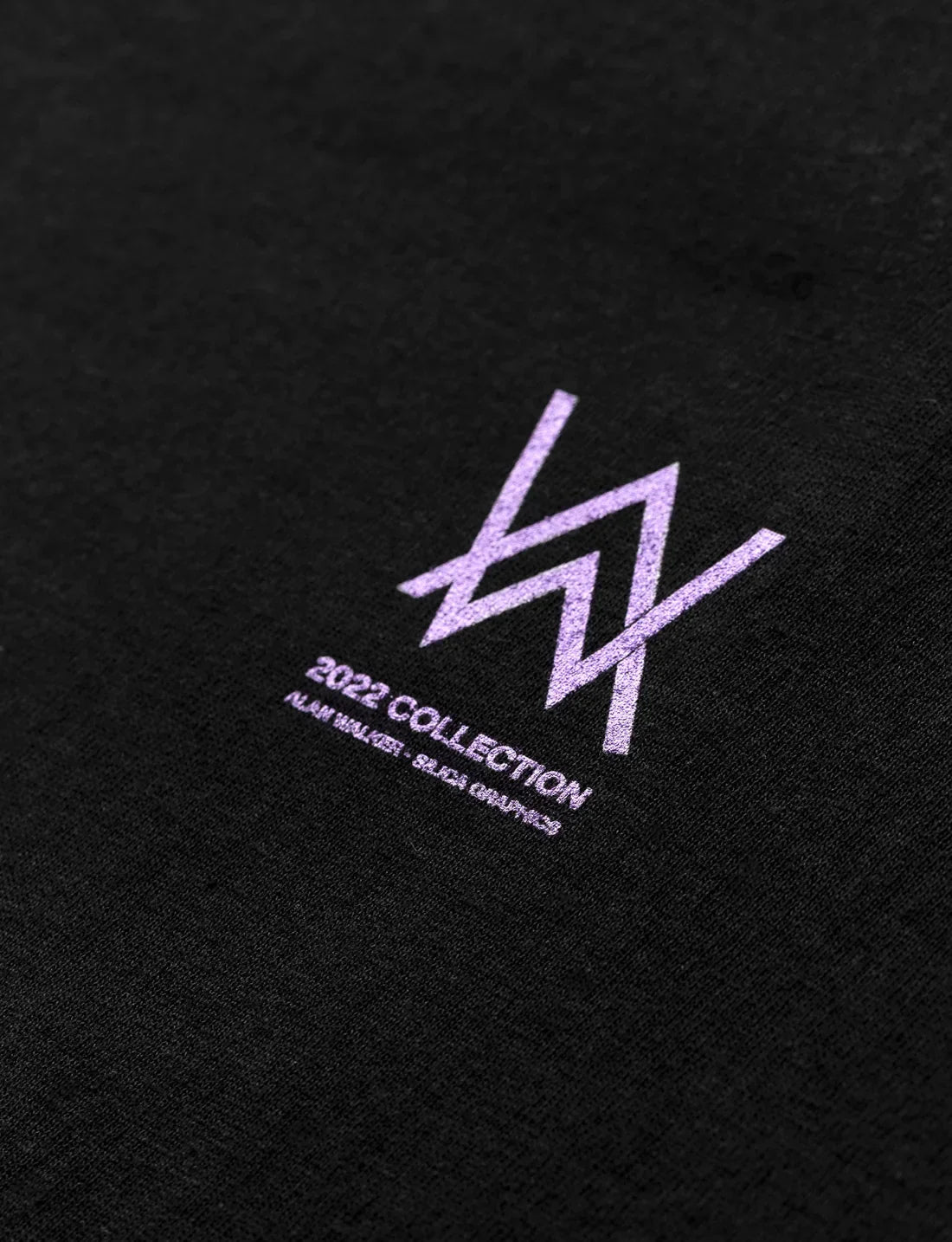 Close-up of the precise embroidered 'World of Walker' logo on the Melting Rose T-shirt, highlighting detailed craftsmanship.