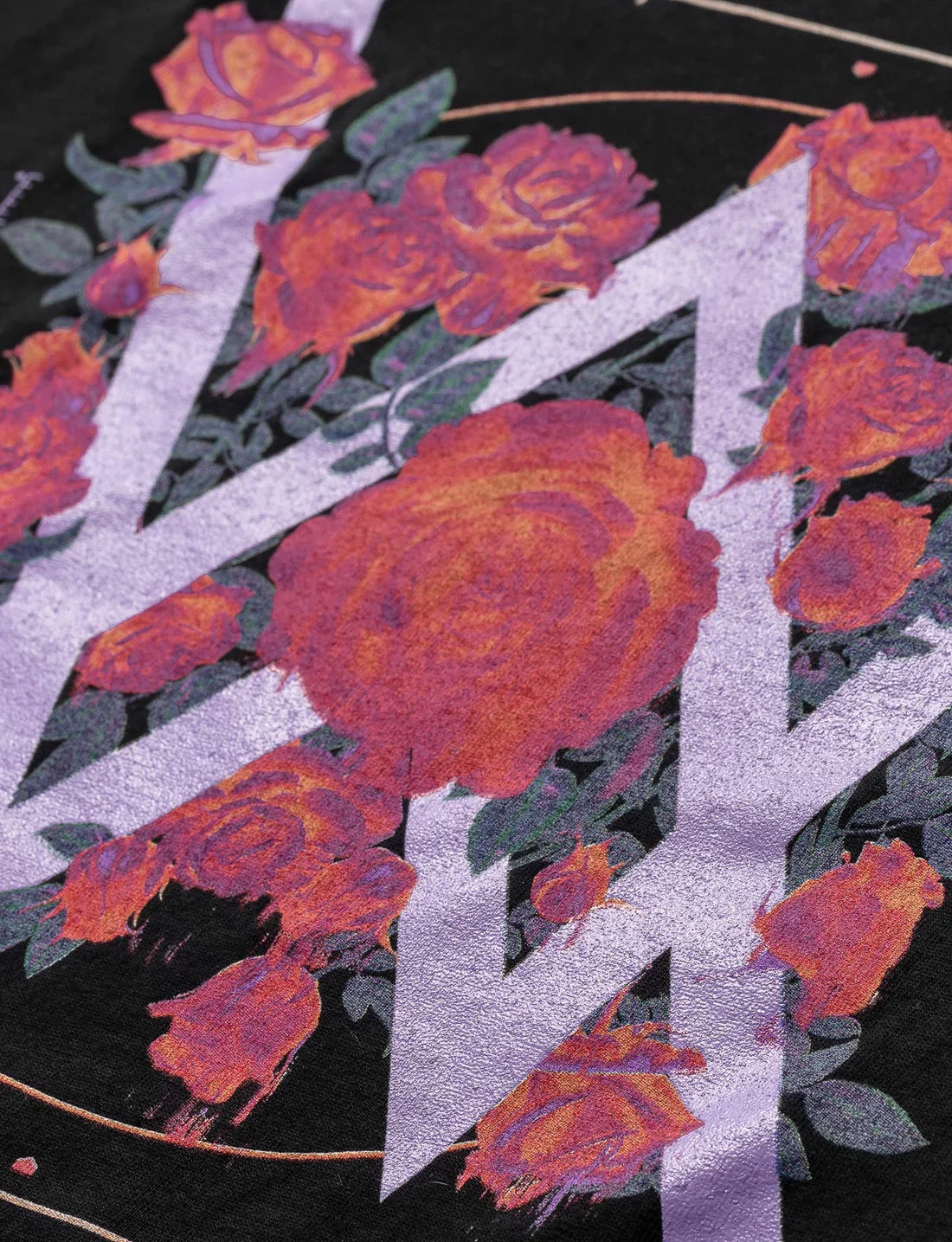 Intricate close-up of the melting rose design on the Melting Rose T-shirt, showcasing artistic flair and color depth.