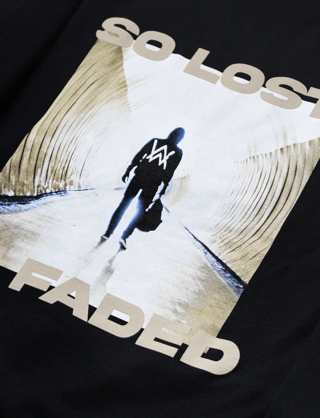 Close-up of the graphic on Alan Walker's black Faded hoodie, with 'so lost' and 'FADED' in white letters over a tunnel silhouette with a figure featuring the 'AW' logo.