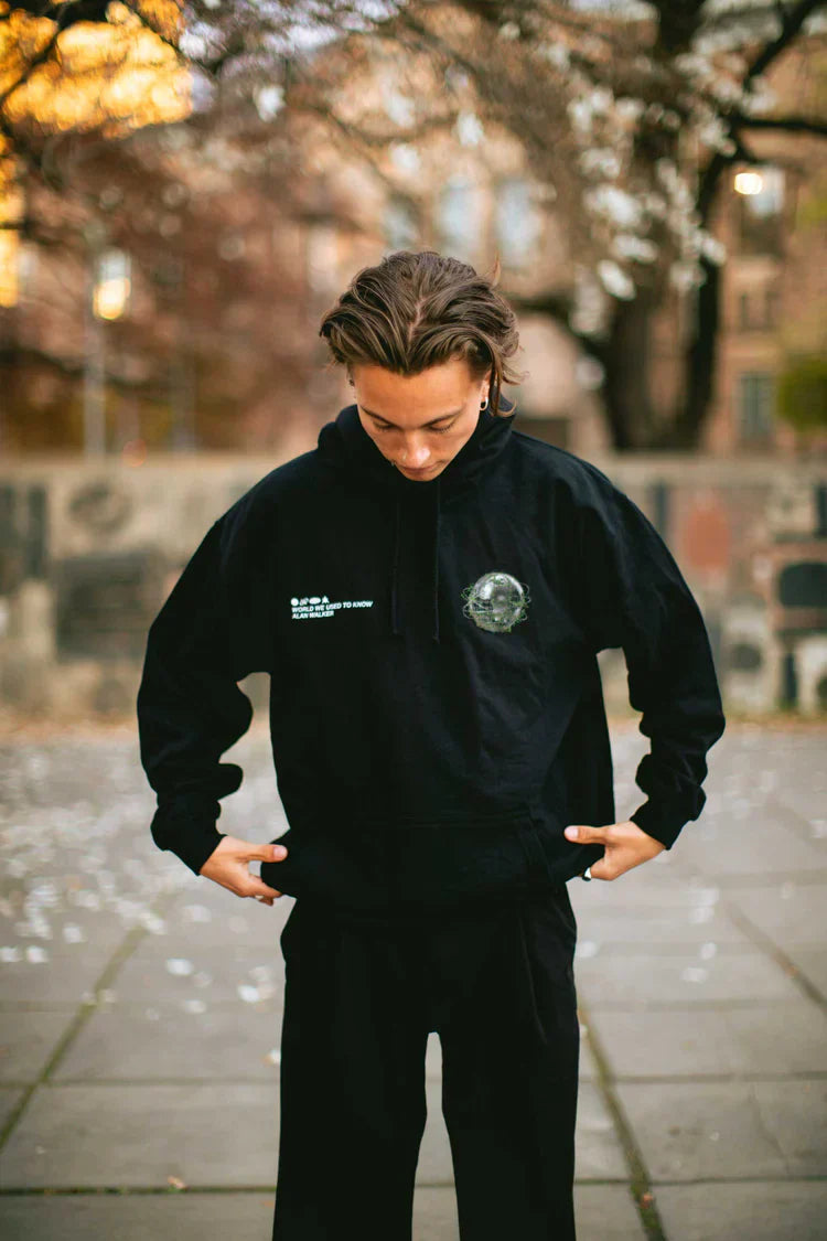 Casual look with the 'World We Used To Know' hoodie, hands in pockets.