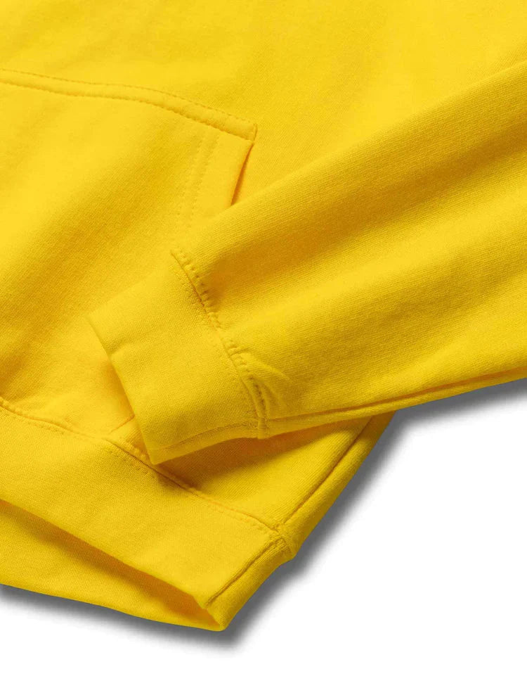 Close-up of the high-quality yellow fabric and hood stitching on Alan Walker kids' hoodie.