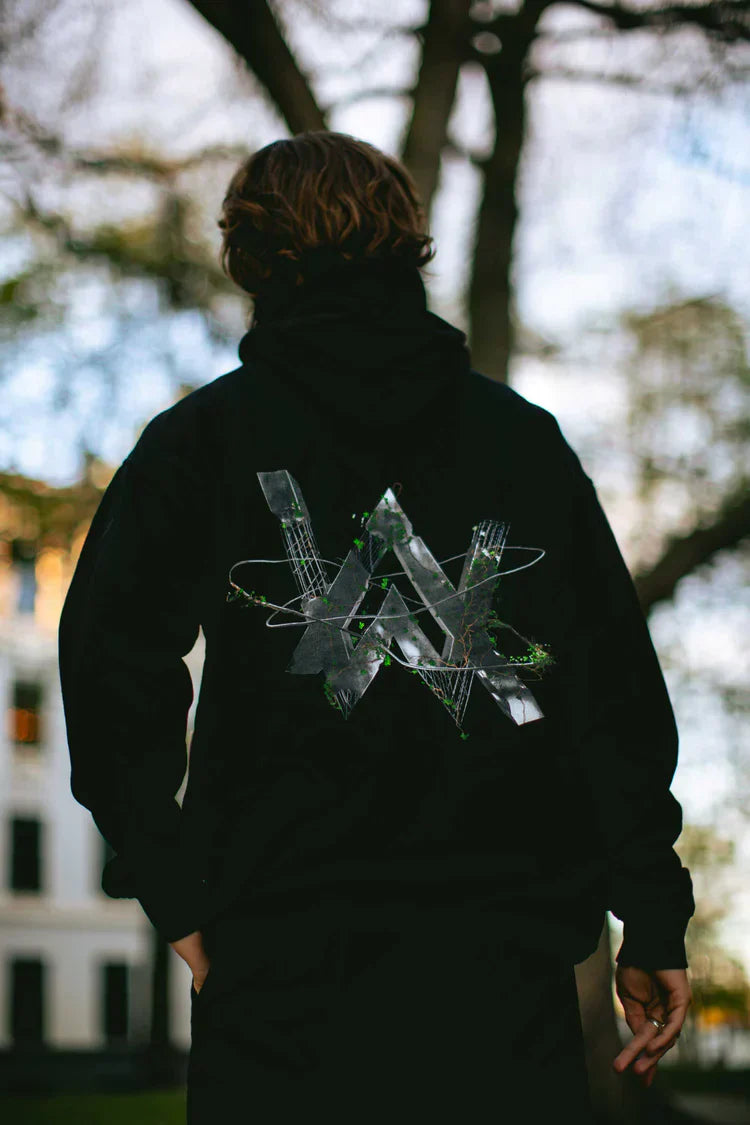 Back shot of a person standing outdoors in the 'World We Used To Know' hoodie.