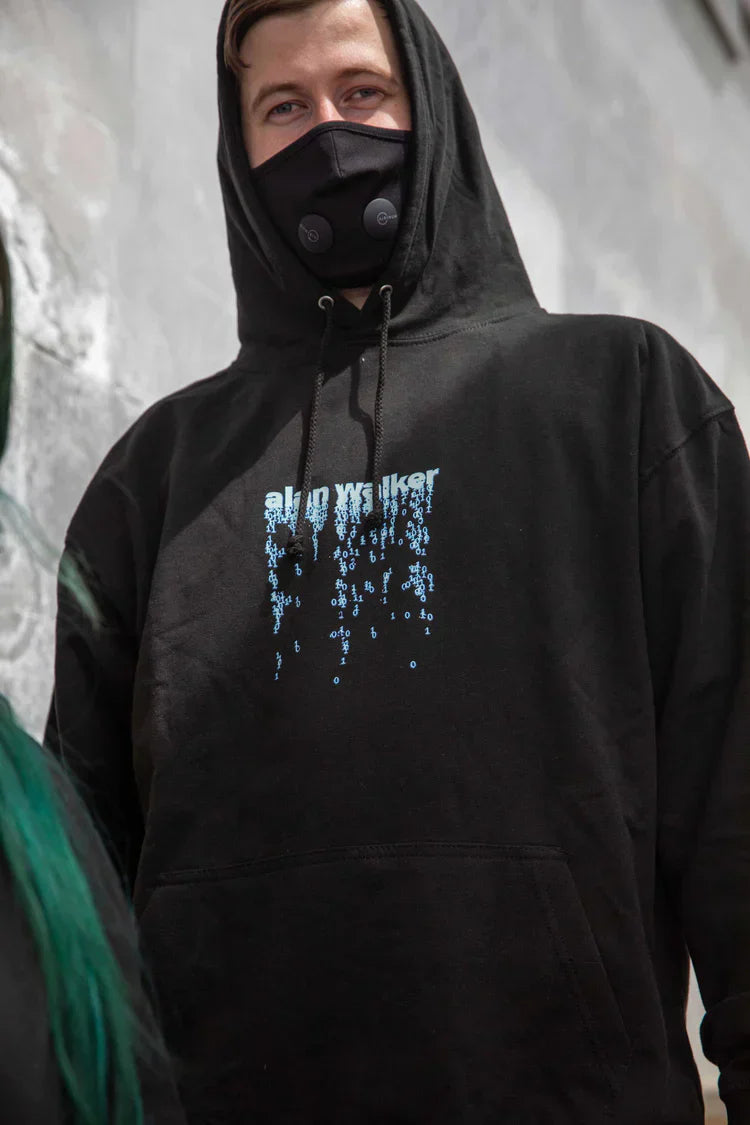 Street style captured with a Alan Walker in an 'alan walker' graphic hoodie, a statement piece for urban electronic music fans.