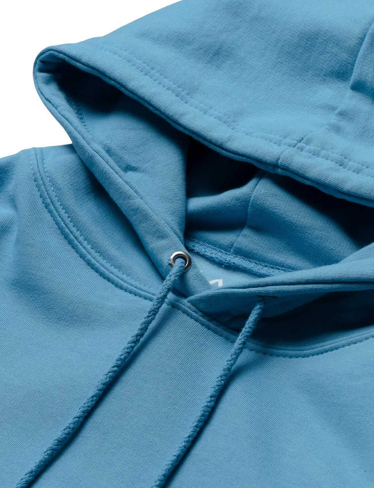 Close-up of the blue hoodie's hood with quality stitching and durable drawstrings, designed for Alan Walker's stage performances.
