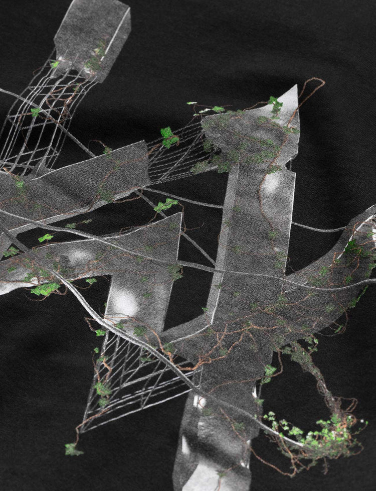 Zoomed-in graphic of the futuristic Alan Walker logo with greenery on the 'World We Used To Know' hoodie.